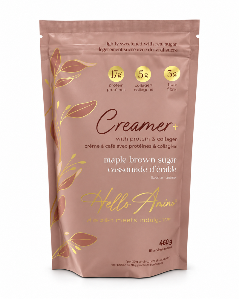 A stand-up pouch of Hello Amino Creamer+ maple brown sugar, featuring a dusty rose-brown background with gold leaf illustrations and yellow circular badges detailing protein, collagen, and fibre content.